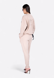 Model wearing crewneck long-sleeve printed T-shirt, back-side view – East Vibe